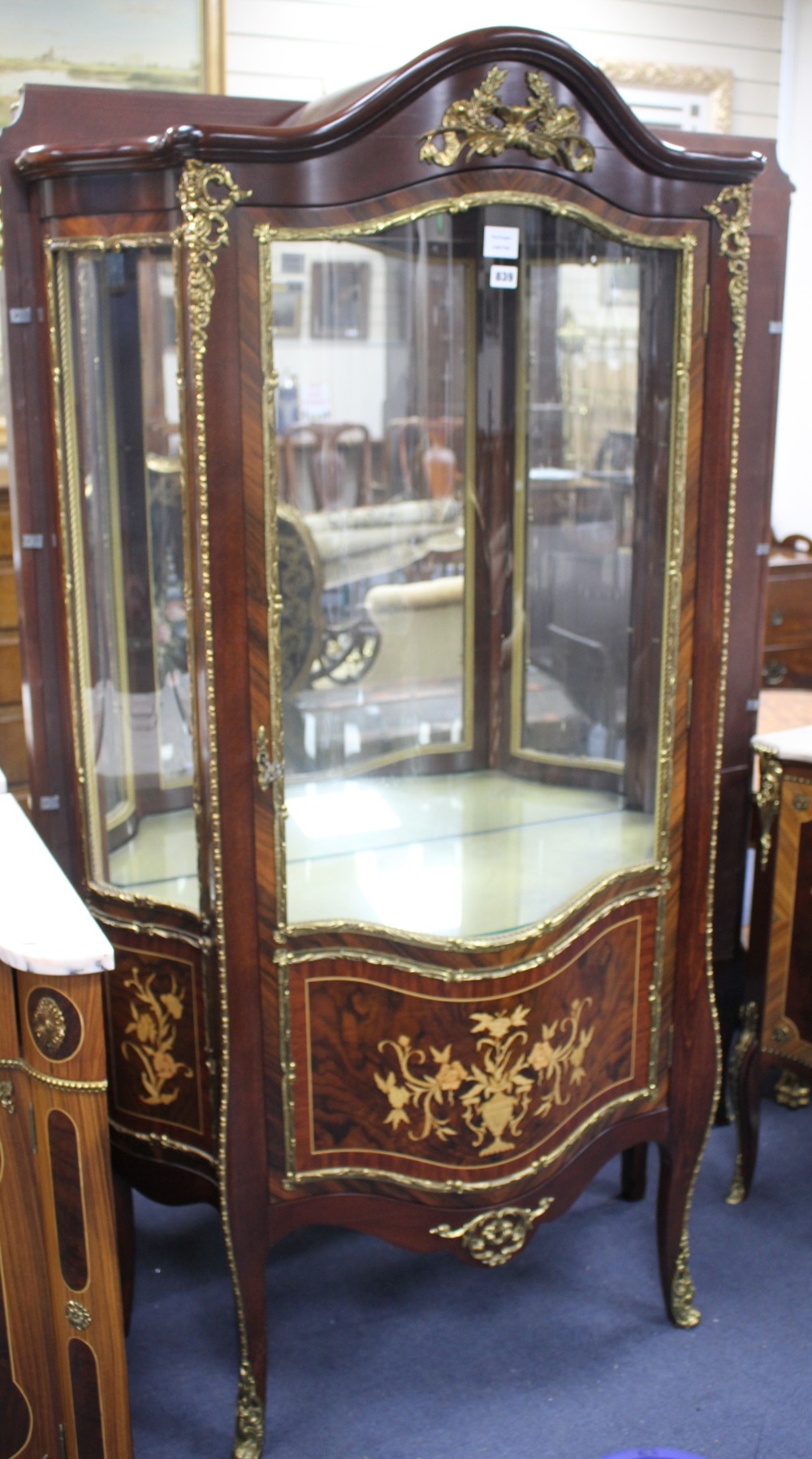 A Meuble Francais marquetry inlaid serpentine vitrine, W.94cm D.40cm  H.180cm